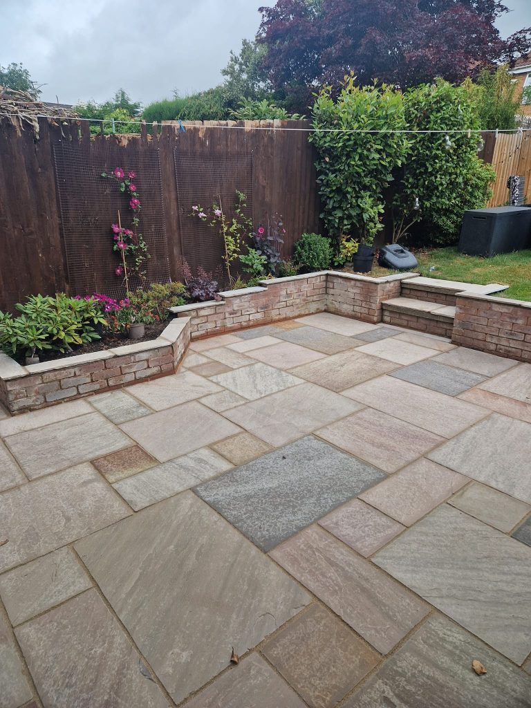 Porcelain patio with outdoor dining area in a Leeds garden, laid by It GROWS on You